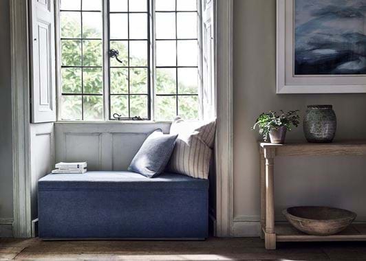 Eloise ottoman in window