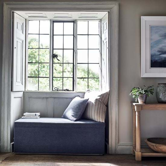 Eloise ottoman in window